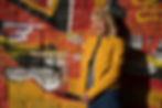 Portrait photo of a woman against a graffiti wall background taken with the Tamron 35-150mm F2-2.8 Di III VXD lens. Photographer Michal Stehlik.