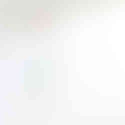 Tirka Earrings Solo hanging styled shot on textured paper