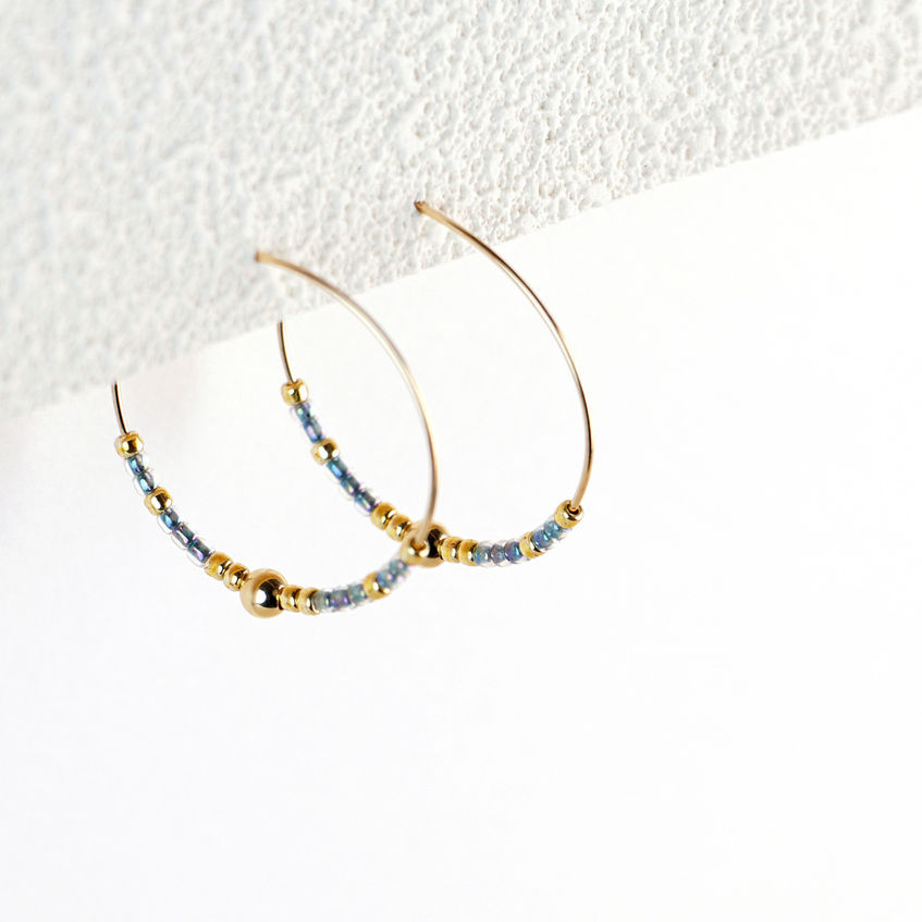 Mia Hoops hanging styled shot on textured paper