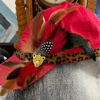 Red with cheeta print an  animal pin and feathers