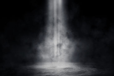 Empty space of Studio dark room with spot lighting and fog or mist on concrete floor in bl