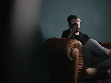 Thinking Man on Couch.webp