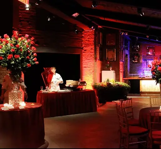 The Encore venue showcases a festive dining arrangement with tables and chairs prepared for an upcoming party celebration.