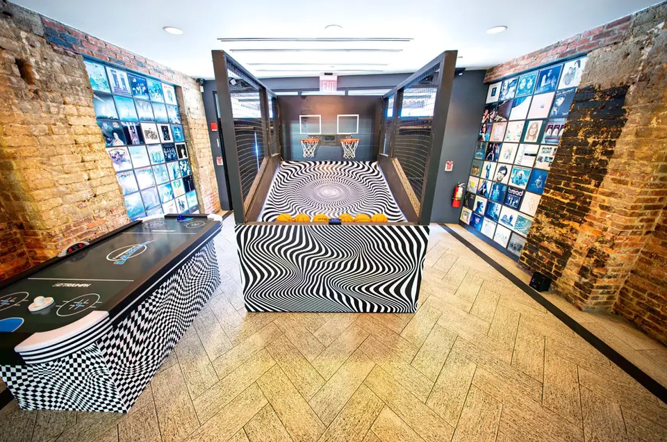 Themed basketball arcade game and air hockey table at the Space.