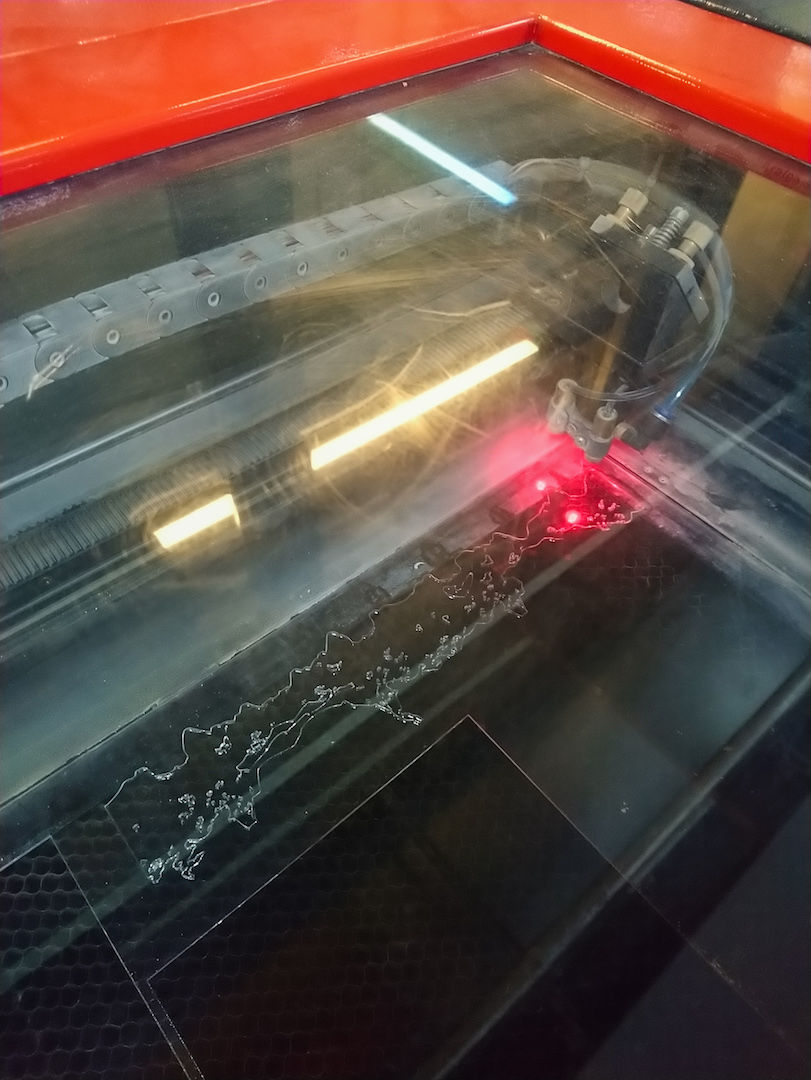 Laser cutting a mushroom scan to emboss on the front cover.