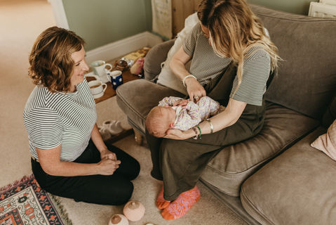 Jen Bolton Doula supporting mother with newborn