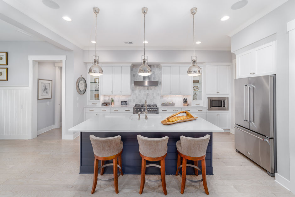 Interior shot of a spacious kitchen with high‑end finishes and natural light
