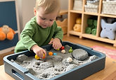 2 years olds playing with a tuff tray in nursery .jpg