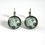 Miniature : Boucles d'oreilles illustrations motifs noirs, fonds turquoise