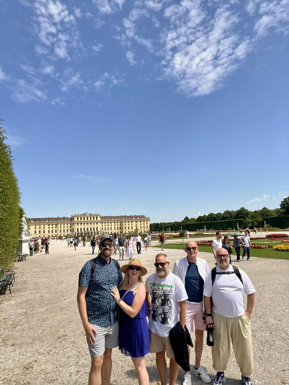 Five people in front of Schonbrunn Palace in Vienna