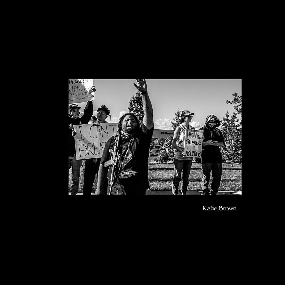 Close-up view of a sign held by a protester advocating for justice