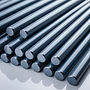 _Nitriding steel rods arranged in parallel. The surface is smooth with a deep grey or dark