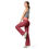Thumbnail: Woman wearing red patterned pants and a gray top poses on white background.