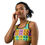 Thumbnail: Young woman wearing a colorful sports bra. Peeking Twin - Sports bra. ArtDivaArt