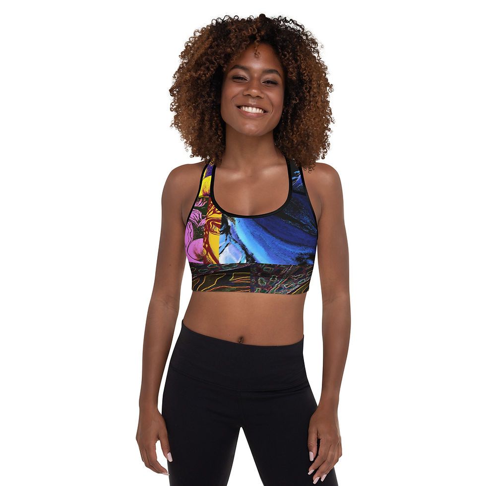 Thumbnail: Smiling woman wearing SEANI - Padded Sports Bra with colorful art on it.