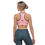Thumbnail: Woman wearing pink sports bra with logo, athletic clothing and background.