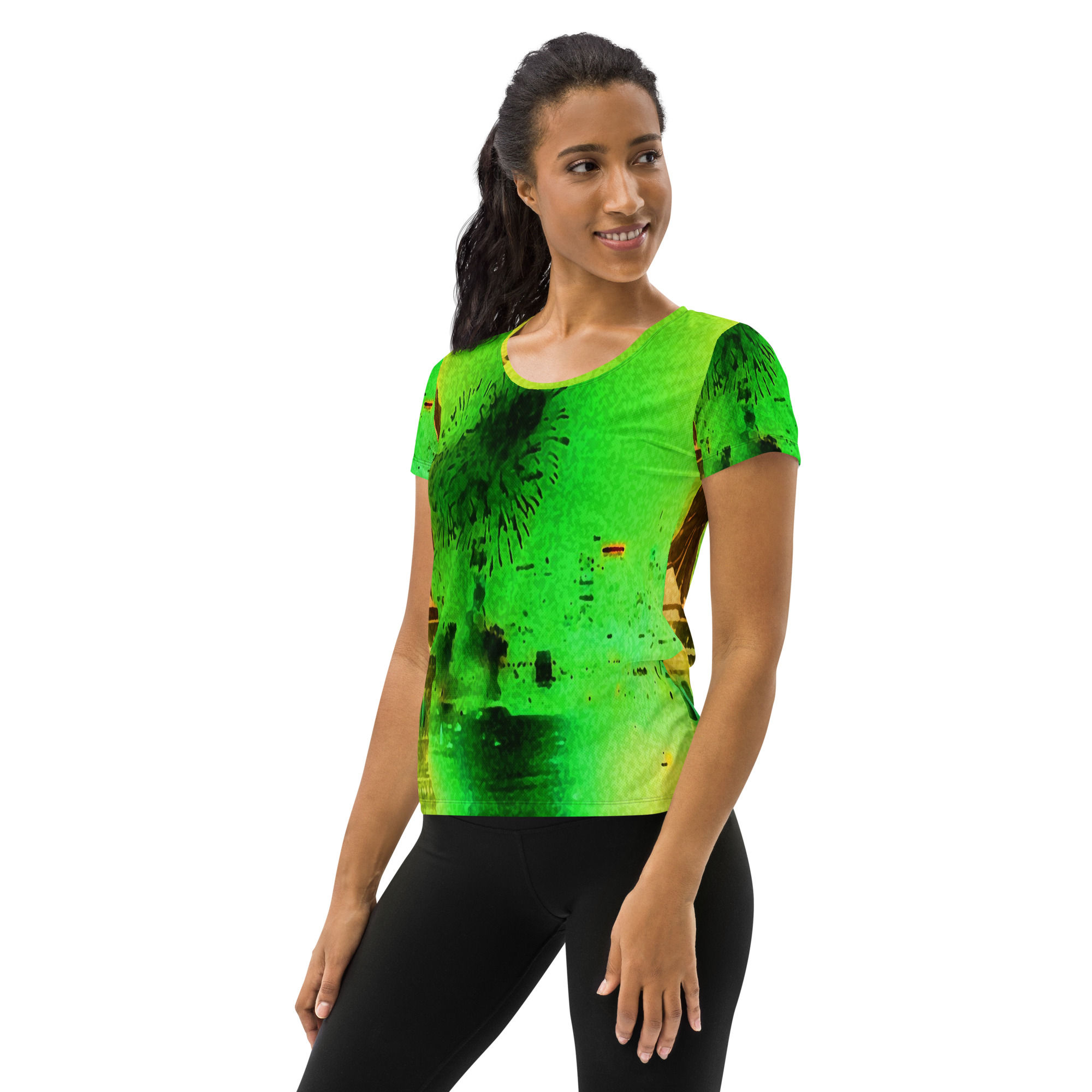 Woman wearing a green shirt, black leggings, DOLLA - Yoga Leggings, abstract art background.