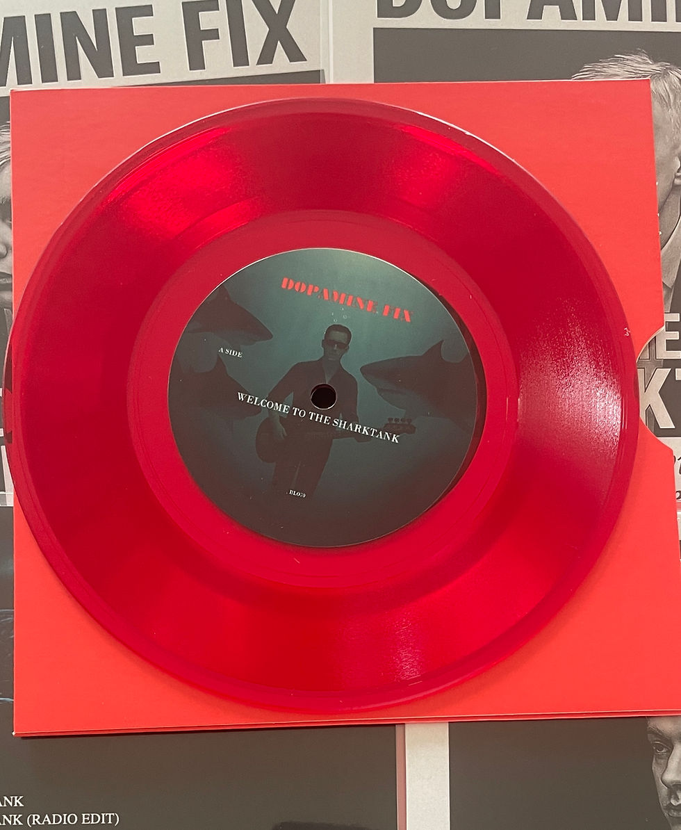 A side of 7" vinyl single Welcome To The Sharktank