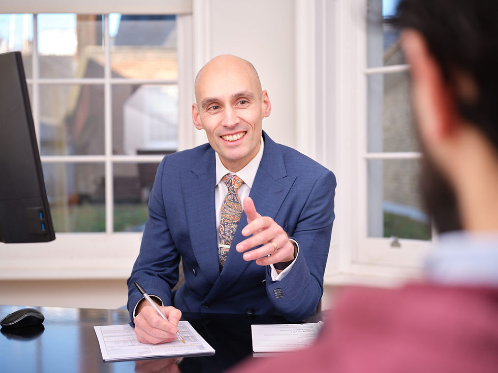 Dietitian consulting with client in private clinic, reviewing health assessment results and providing personalised strategy for executive health and performance optimisation.