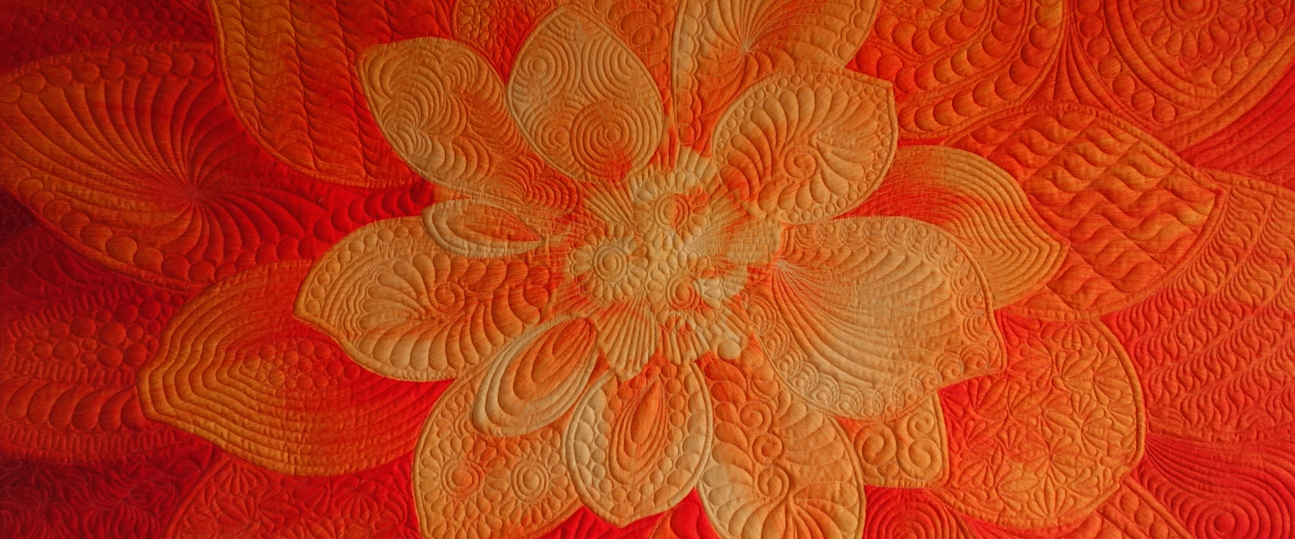 Orange Wishes, Hoffman Dream Big panel quilted by Joyce Blowers