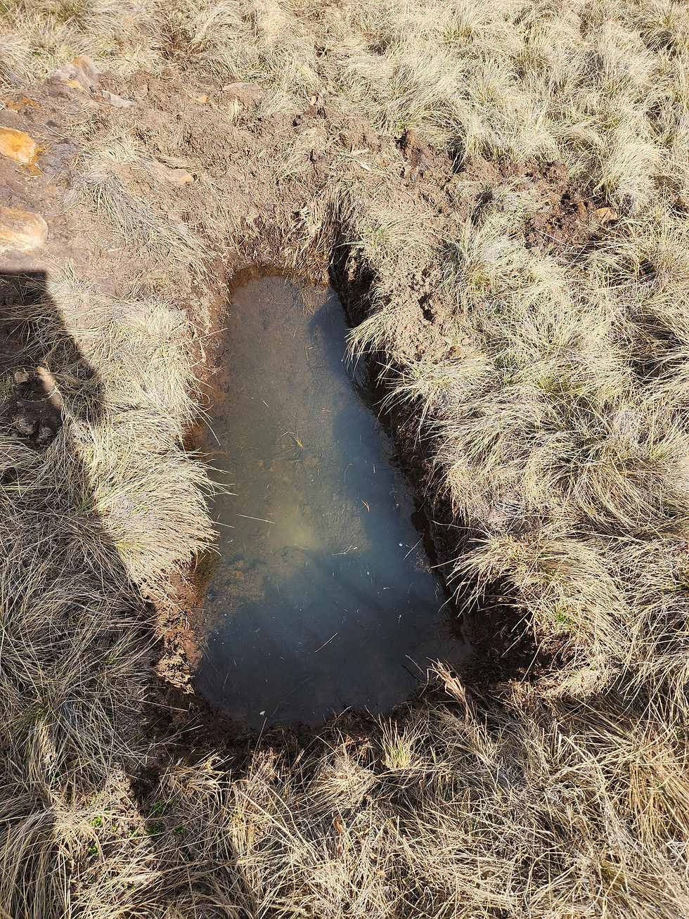 Wide angle view of a Colorado residential lot with soil testing equipment