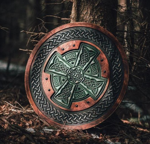 Shield with carved Celtic cross motif | Black Acorn Workshop