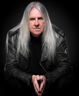 Legendary Saxon Frontman Launches Video For SCHOOL OF HARD KNOCKS