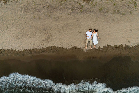 Durham Region engagement photographer capturing a romantic beach engagement session at sunset in Pickering