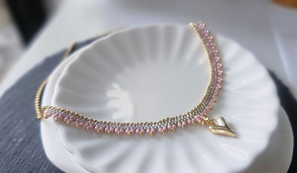 Hand beaded necklace with heart shaped charm