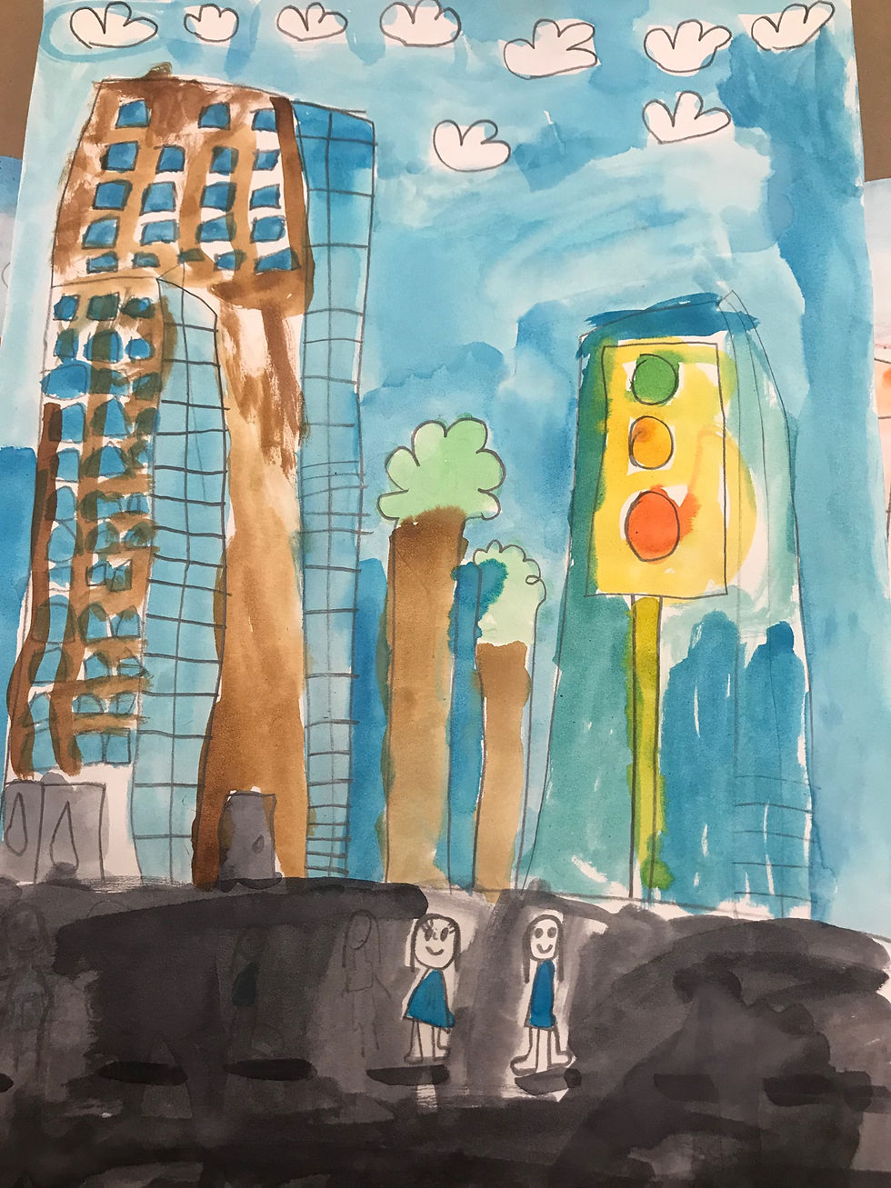 A student's drawing of a cityscape