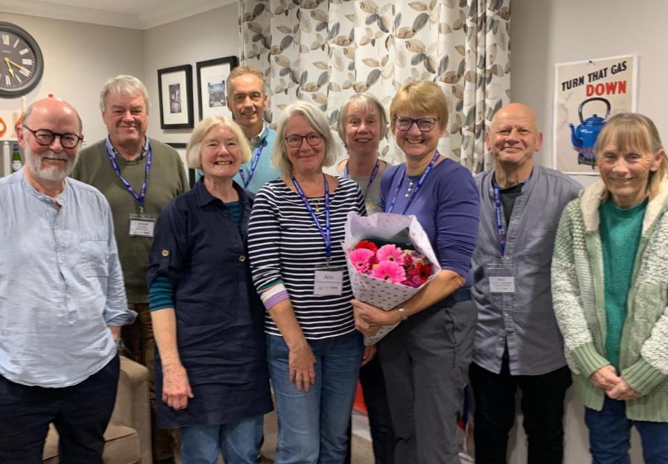 Julia West (with the flowers) and other members of the Management Team