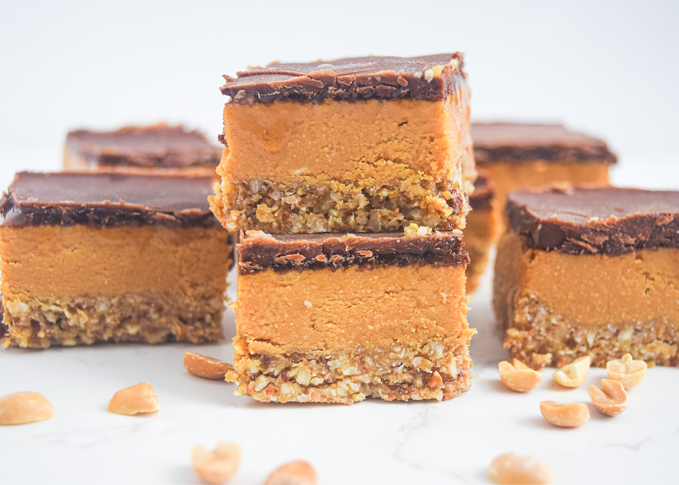 These delicious, layered, plant-based, dessert bars are made from the classic chocolate & peanut butter combo (and infused with lots of love)! A nutty crust layer, thick peanut butter layer, and topped with chocolate - it's a must try sweet treat! Make a batch to serve and share or store in the freezer for when chocolate cravings come! This vegan dessert uses wholesome and minimal ingredients to support a healthy lifestyle! Plant-based abundance, not deprivation!