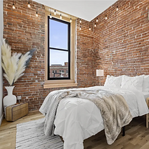 DayBNB - Bedroom with Bricks.png