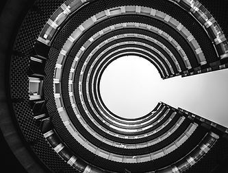 Shot looking up to the sky through buildings