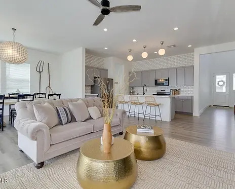 Updated track home in a modern farm house style has custom lighting and timeless backsplash