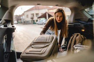 Girl packing car for college