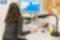 rear-view-of-woman-sitting-at-the-desk-in-an-offic-2025-02-13-02-34-54-utc.jpg