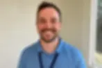 Smiling NDIS worker