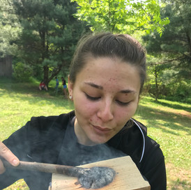 Girl with coal-burned bowl.jpeg