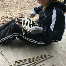 Girl making willow tray.jpeg