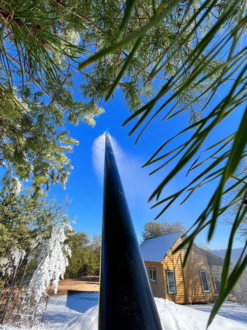 SnowBnB machine blowing snow outside a short-term rental in Gatlinburg, TN