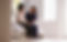Nurse sitting on bed with female elderly client