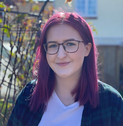 Lydia Finn standing in a garden