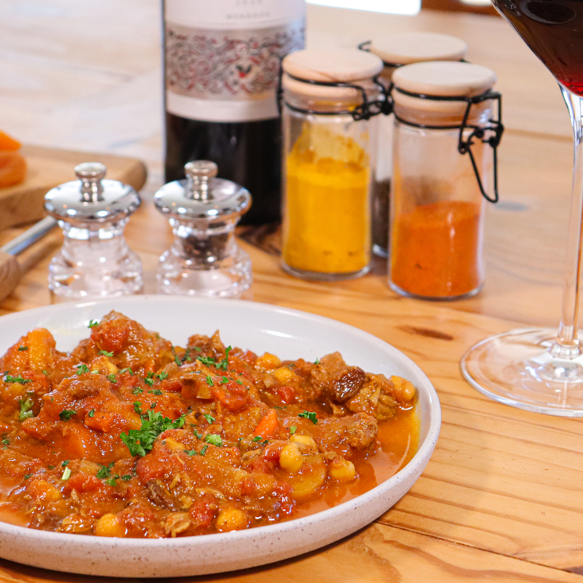 Close-up of Moroccan lamb tagine with chickpeas and fresh herbs