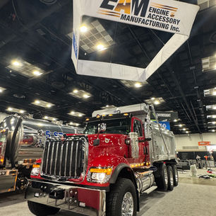 Tri-axle 2027 International HX520 dump truck with DuraClass DuraTuff SD body at WWETT 2026 trade show booth