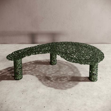 A freeform indoor or outdoor coffee table featuring dozens of finely detailed cast bronze butterflies with green patina.