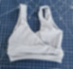 Gray ribbed crop top on blue grid cutting mat with white lines and numbers.