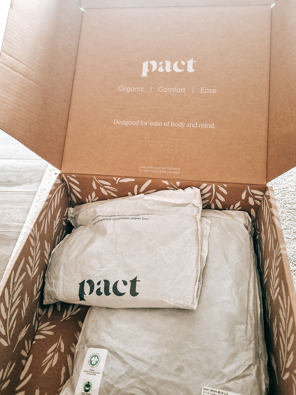 Open cardboard box with PACT organic bedding packages; lid reads Organic | Comfort | Ease and Designed for ease of body and mind.