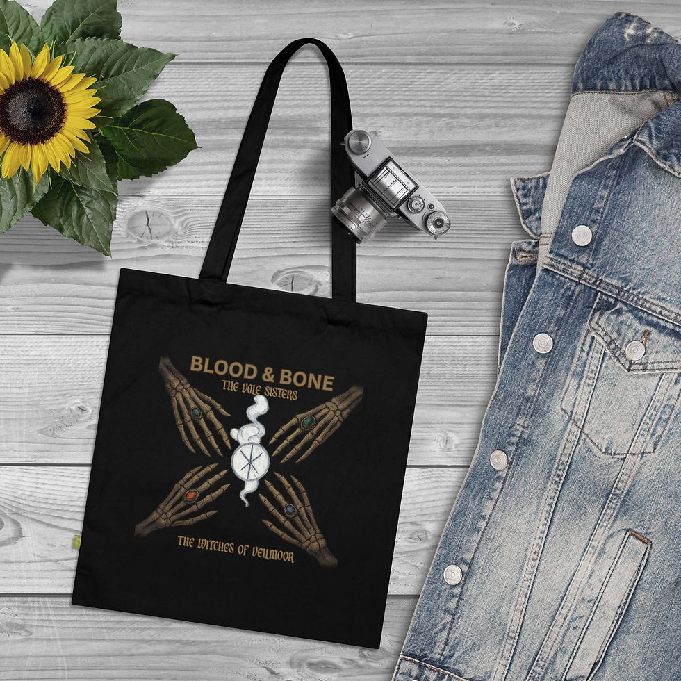 Thumbnail: Black Blood & Bone tote bag with floral design, denim jacket background.