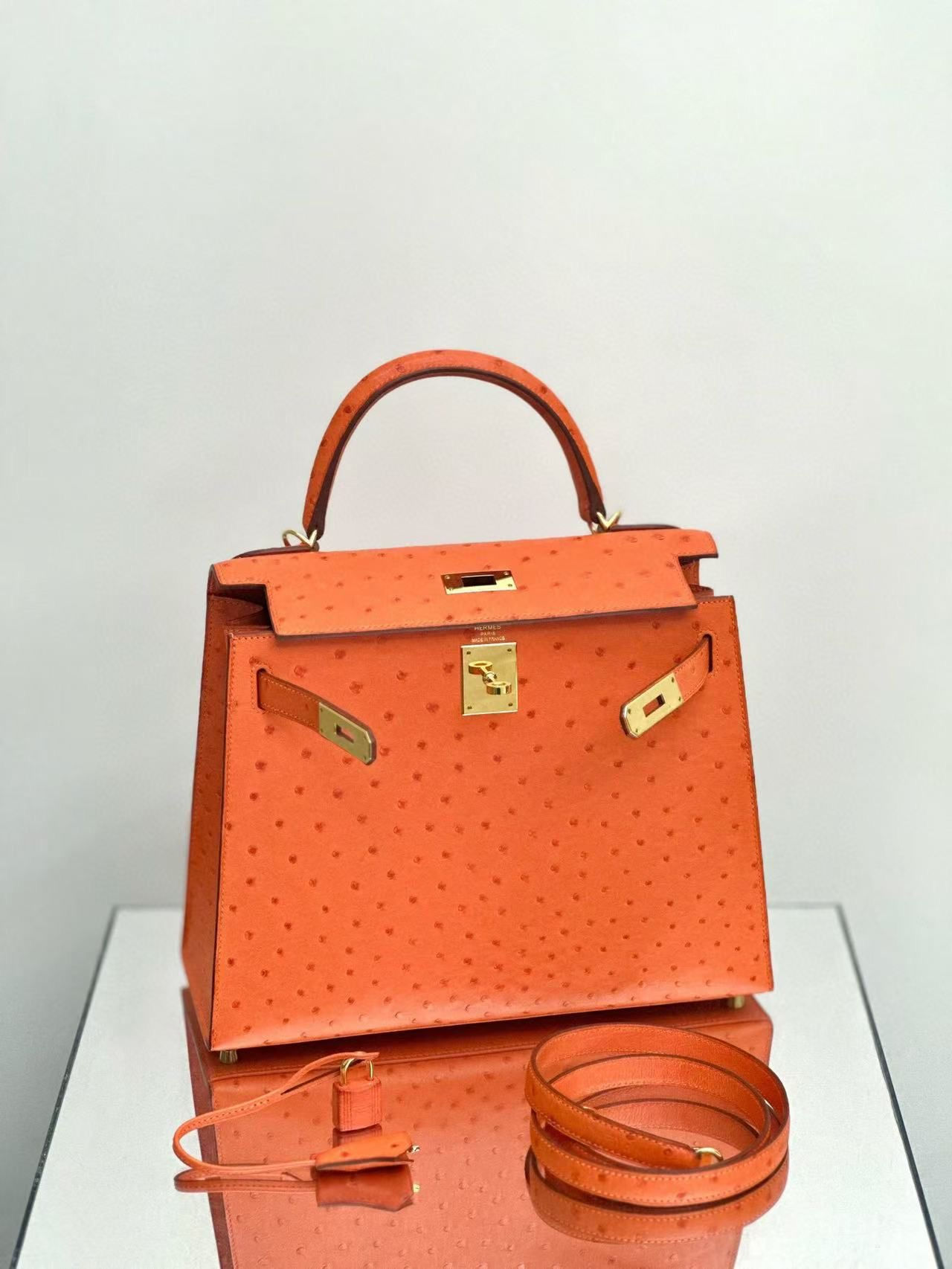 Kelly 28 | 9T Capucine | GHW | Ostrich | X Stamp